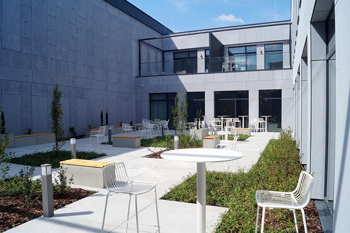 patio in chemnovatic's new hq: tables, chairs, plants