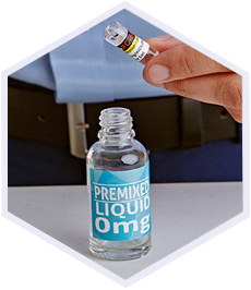 a bottle with a label: premixed liquid 0mg and a hand holding a small bottle above it